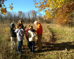 Ray Potter examines prairie plant seeds with 4th graders from Gateway Elementary on a gorgeous fall day.